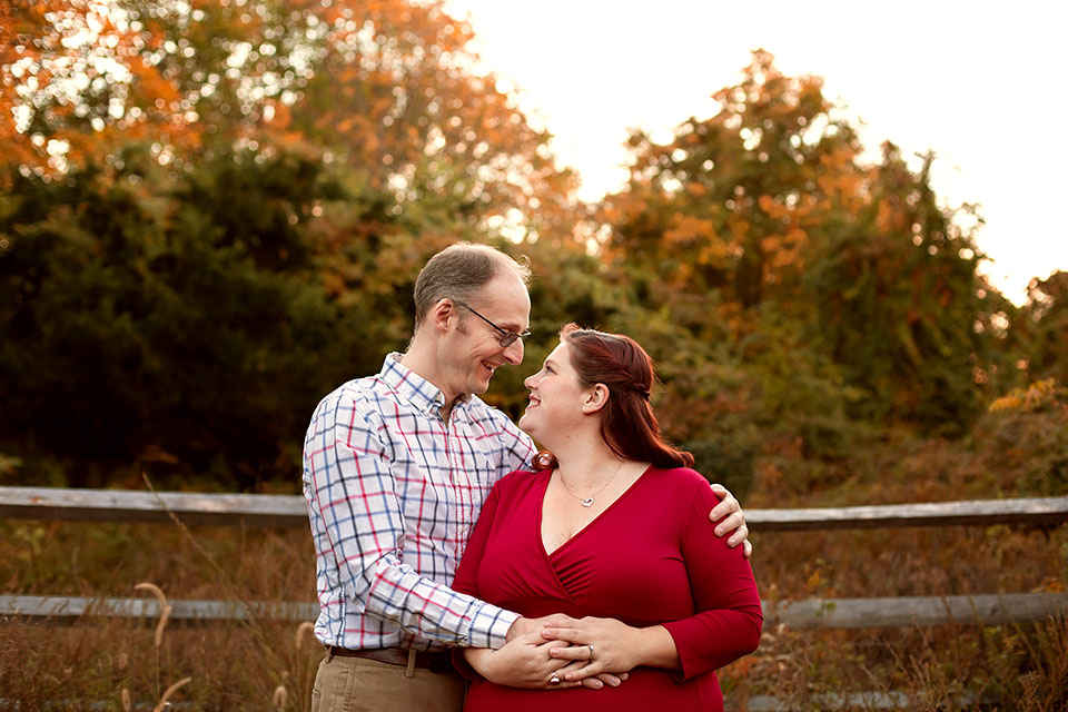 Pregnant woman taking photos with family